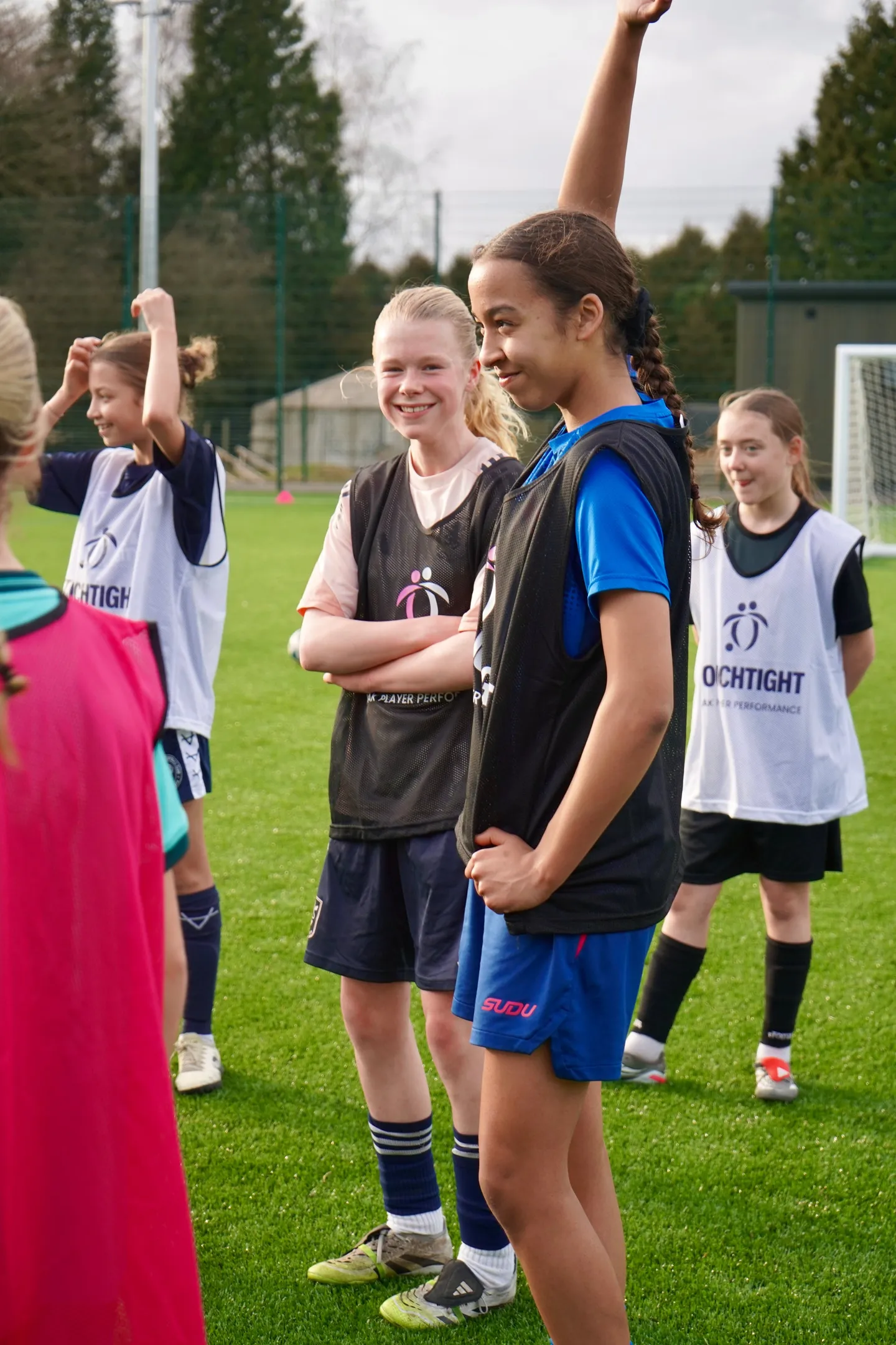 Young players in Touchtight bibs together after training